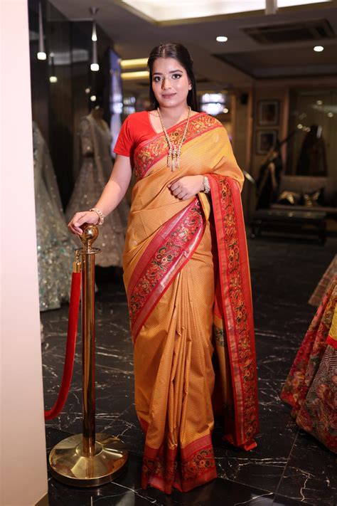 Stunning Orange Banarasi Saree with Elegant Red Border – ODHNI