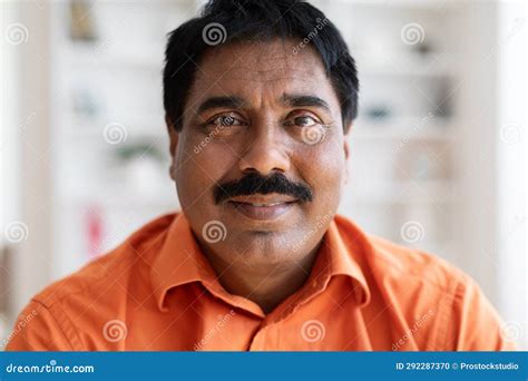 Closeup Portrait of Middle Aged Indian Man Wearing Orange Shirt Stock ...