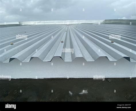 Close up of a corrugated metal deck roof system just installed on a ...