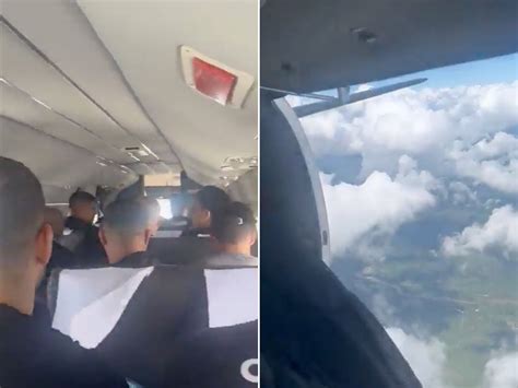 Flight makes emergency landing after plane door bursts open mid-air ...
