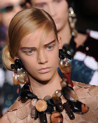 Golden straps: A model presents a creation for Salvatore Ferragamo ...
