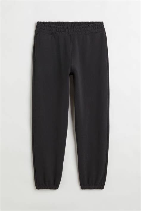 Relaxed Fit Cotton joggers - Black - Men | H&M IN