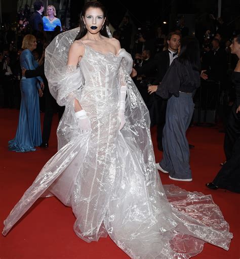 Julia Fox hits 2023 Cannes Film Festival red carpet in plastic poncho gown