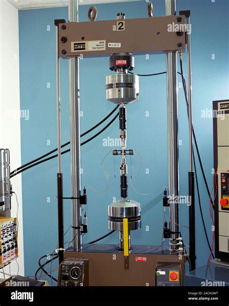 Tensile specimen in an MTS testing machine. Aluminium alloy (2219) tensile specimen in an MTS ...