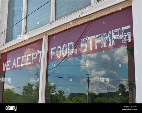 old market window with we accept food stamps sign Stock Photo - Alamy