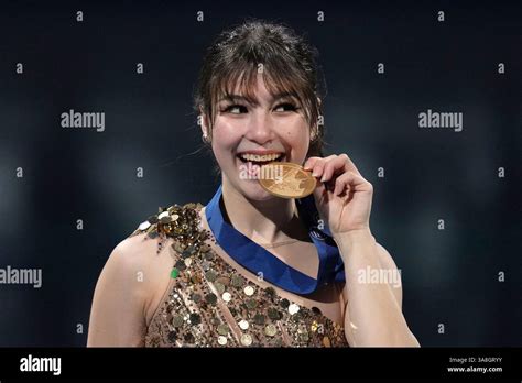 Feb 19, 2026; Milan, Italy; Alysa Liu of the United States celebrates with the gold medal in the women's free skate during the Milano Cortina 2026 Olympic Winter Games at Milano Ice Skating Arena. Mandatory Credit: James Lang-Imagn Images