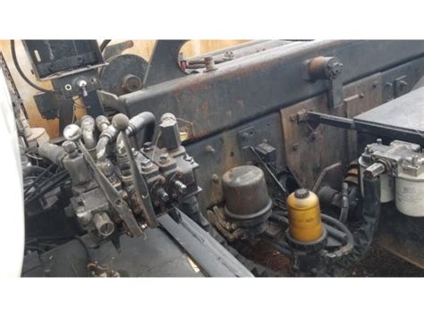 1995 MACK DM ROLL-OFF TRUCK in Miami, FL, USA