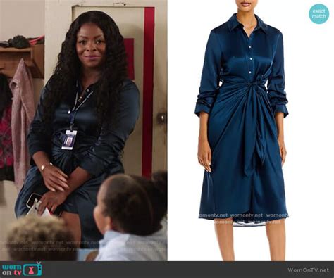 WornOnTV: Ava’s navy satin twist front dress on Abbott Elementary ...