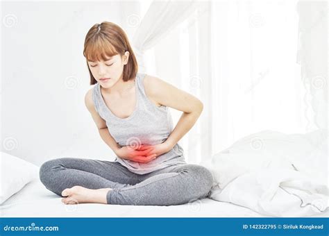 Women Have Abdominal Pain on the Mattress. Stock Image - Image of bacterial, deficiency: 142322795