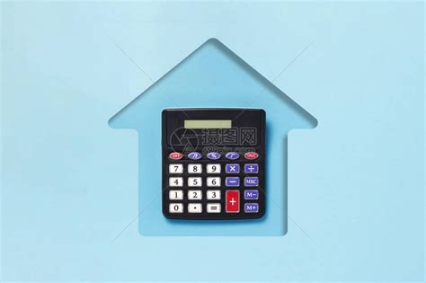 蓝纸板切割成房屋和计算器的形状购买住房抵押贷款家庭信贷规划等概念平高清图片下载-正版图片505858596-摄图网