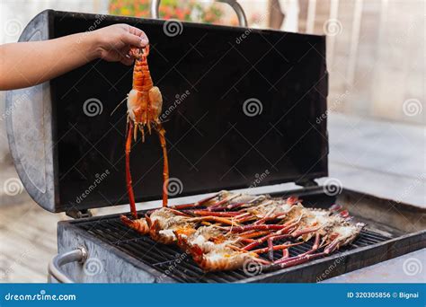 Grills King Prawns on Charcoal Grill in the Restaurant. Stock Photo ...