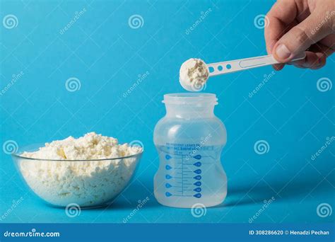 Preparation of Baby Milk Food for Feeding Babies. Powdered Milk Mixture ...