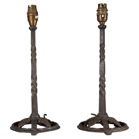 A pair of good quality of hand wrought and twisted iron table lamps For ...