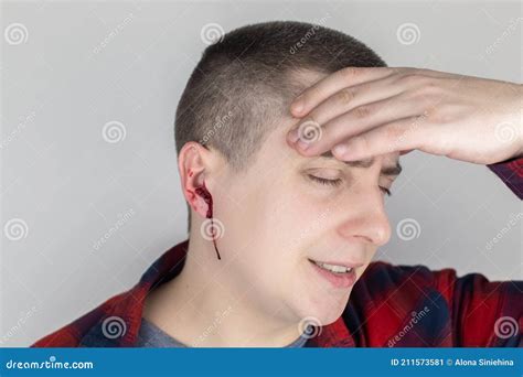 A Man Whose Ear is Bleeding. Vascular Rupture, Damage To the Tympanic Membrane, Ear Diseases ...