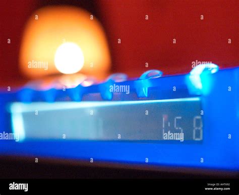 Digital clock and candle Stock Photo - Alamy