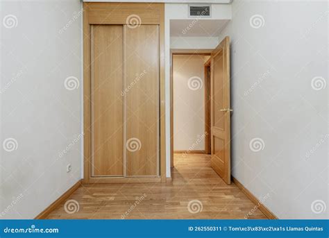 Bedroom With A Small Built-in Wardrobe With Sliding Oak Doors In A Room ...