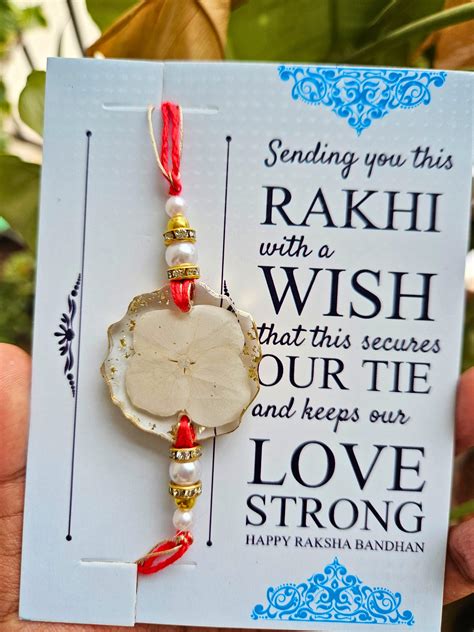 Snow White Rakhi – Elegant Silver Rakhi Online | Elnorah