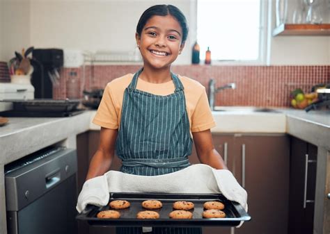 Baking cookies and girl portrait happy about food learning and youth ...