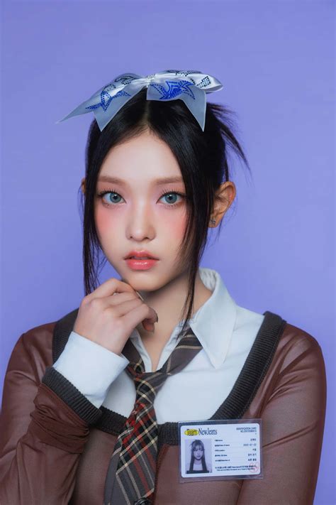 Download Stylish Studentwith Blue Eyesand Bow Wallpaper | Wallpapers.com