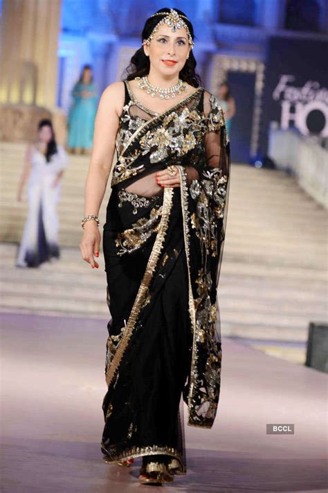 A participant walks the ramp during a fundraiser fashion show organised ...