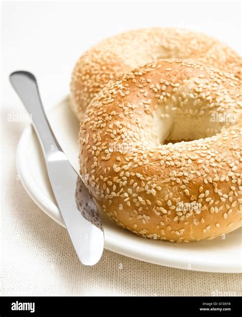 Table with poppy seed bagel Stock Photo - Alamy