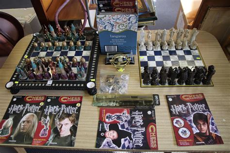 Lot - 2 COMPLETE HARRY POTTER CHESS SETS WITH STEP BY STEP MANUAL CHESS ...