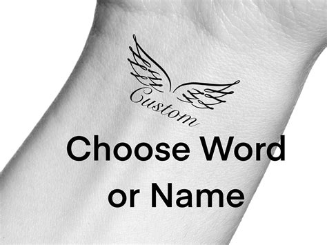Tattoos Of Angel Wings With Names at Lucinda Wise blog