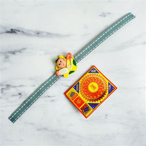 Buy Handmade Porcelain Clay Themed Rakhi With Roli Chawal Online On Zwende
