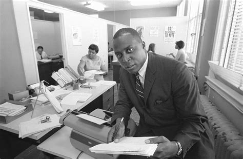 Lawyer Vernon E. Jordan working on a voter education project at the ...