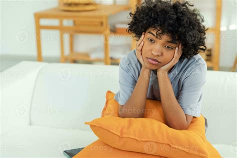 African american sad thoughtful pensive unmotivated girl sitting on ...