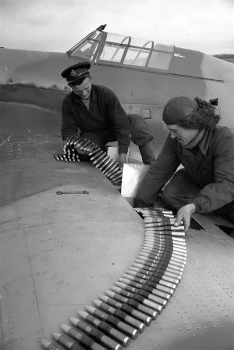 two men working on an airplane with metal strips attached to the wing ...
