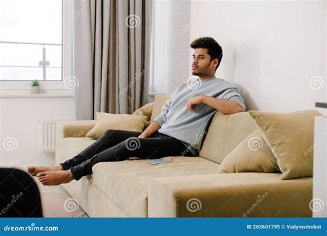 Young Indian Man Relaxing and Sitting on Sofa Stock Image - Image of ...