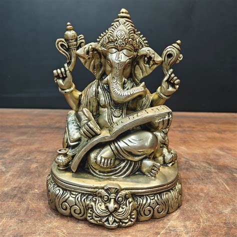 Brass Lord Ganesha Statue Writing Mahabharata 8 Inch – StatueStudio