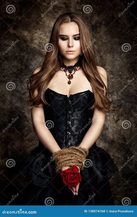 Gothic Woman Black Dress, Flower Rose in Hands Tied by Rope, Fashion ...