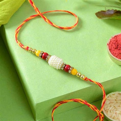 Send White Bead Rakhi Online | Rakhibazaar.com