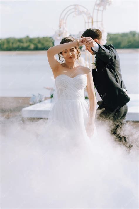 Premium Photo | The first dance of the bride and groom inside a restaurant