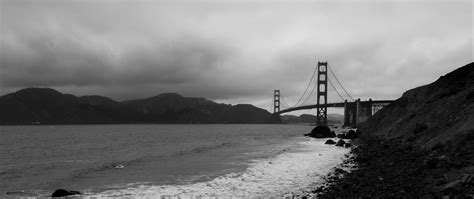 Download wallpaper 2560x1080 coast, sea, bridge, black and white dual ...