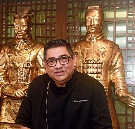 Restaurateur Anjan Chatterjee wears his Chef’s jacket, picks up a wok ...
