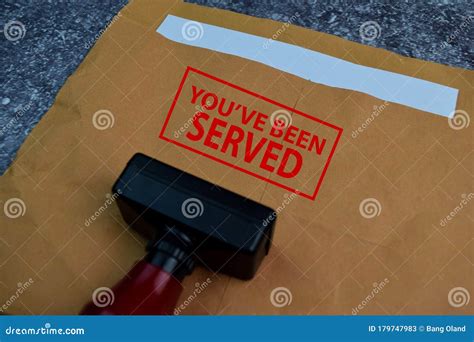 Red Handle Rubber Stamper and You`ve Been Served Text Isolated on the ...