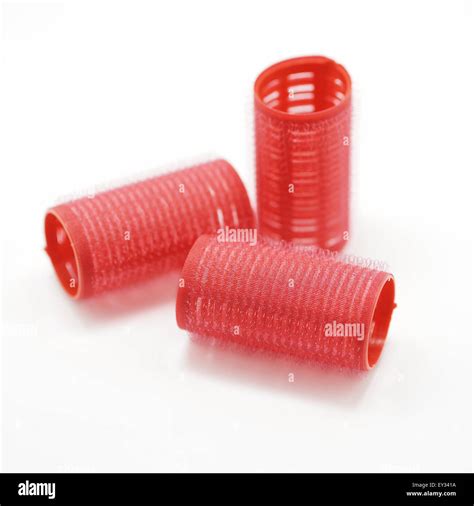 red hair curlers isolated on white background Stock Photo - Alamy