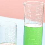 Free Stock image of Two measuring beakers filled with green liquid ...