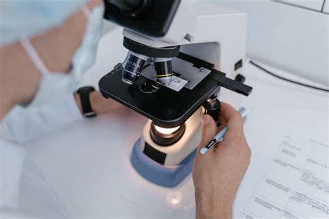 Image result for A Person Inspecting Using Microscope