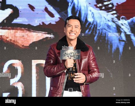Hong Kong actor Donnie Yen laughs during a press conference for his new ...