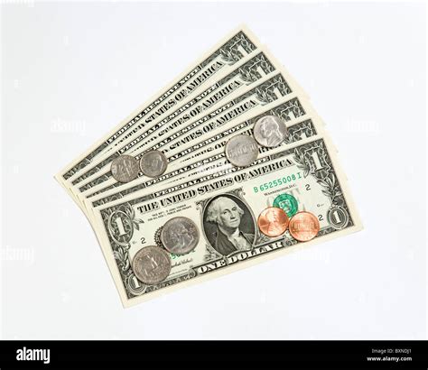 Money US Currency Paper one dollar banknote and coins one cent penny ...