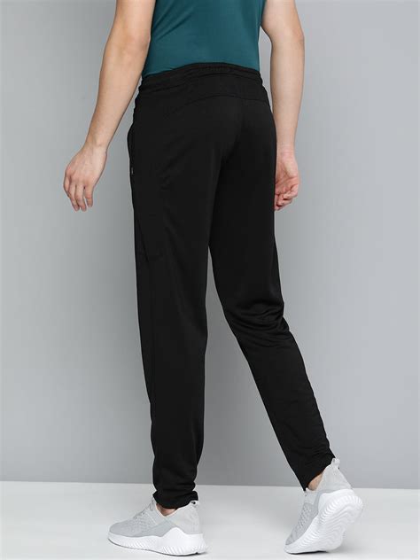 Buy Alcis Men Black Solid Slim Fit Track Pants AAMTRASM00054301-S Online.
