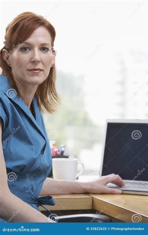 Businesswoman Sitting in Office Stock 的图像结果