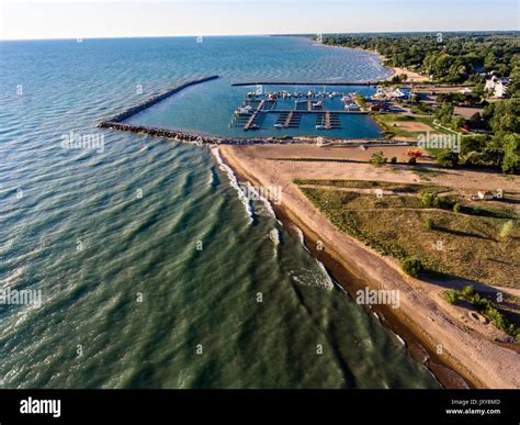 Aerial view of Lexington Michigan on Lake Huron showing a man made ...