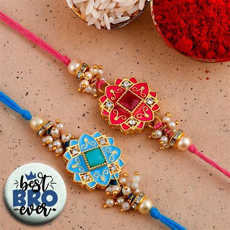 eCraftIndia Set of 2 Purple Floral & Pearl Designer Rakhis with Roli ...