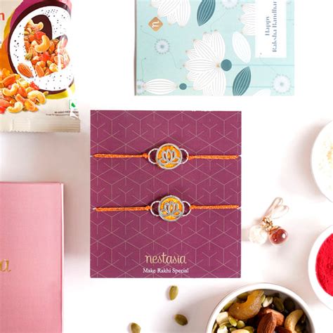 Lotus Rakhi Gift Set Of 4 With Box And Card Online - Premium Gift ...