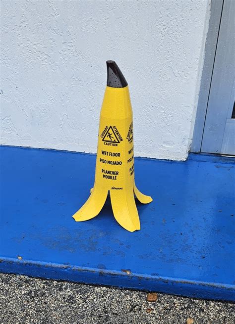 This wet floor warning cone is a banana peel. : r/bananawetfloorsign